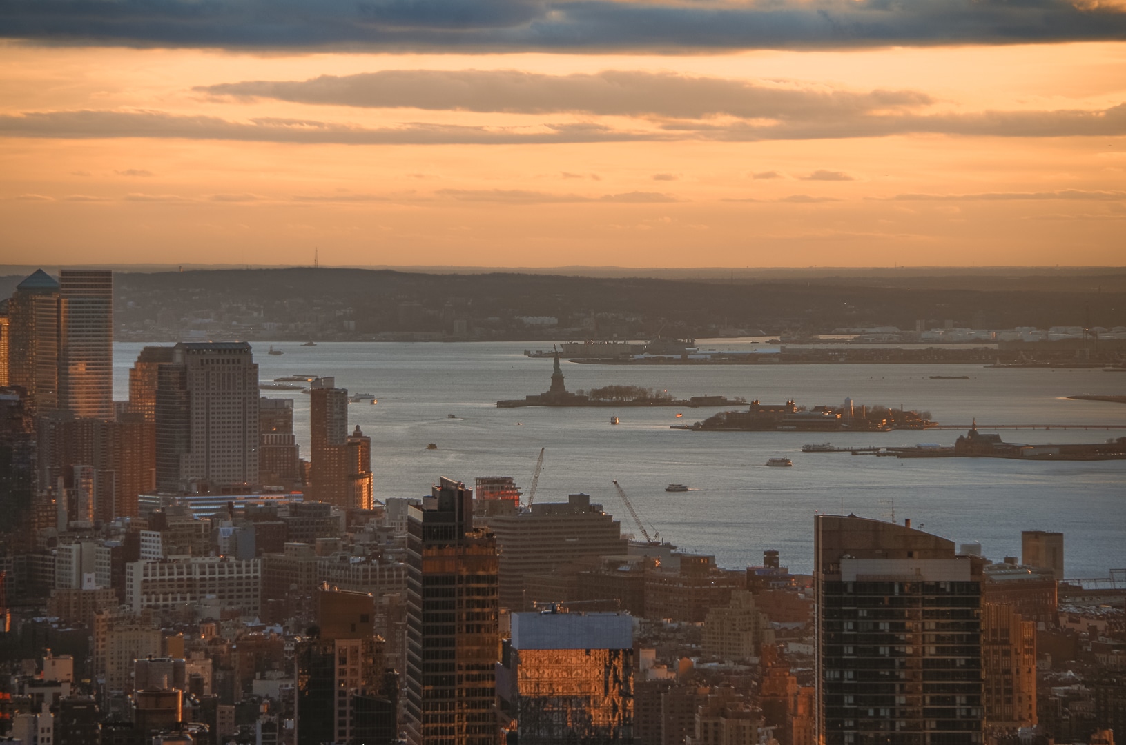 sunset statue de la liberté depuis top of the rock NYC